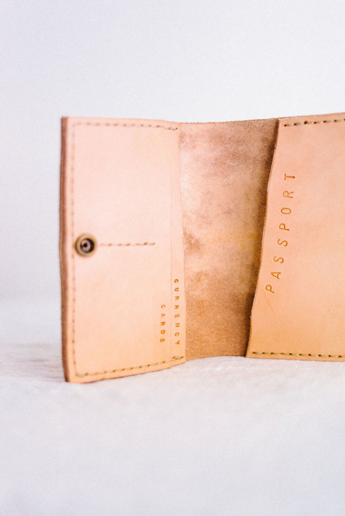 stone wild collective veggie tan passport holder