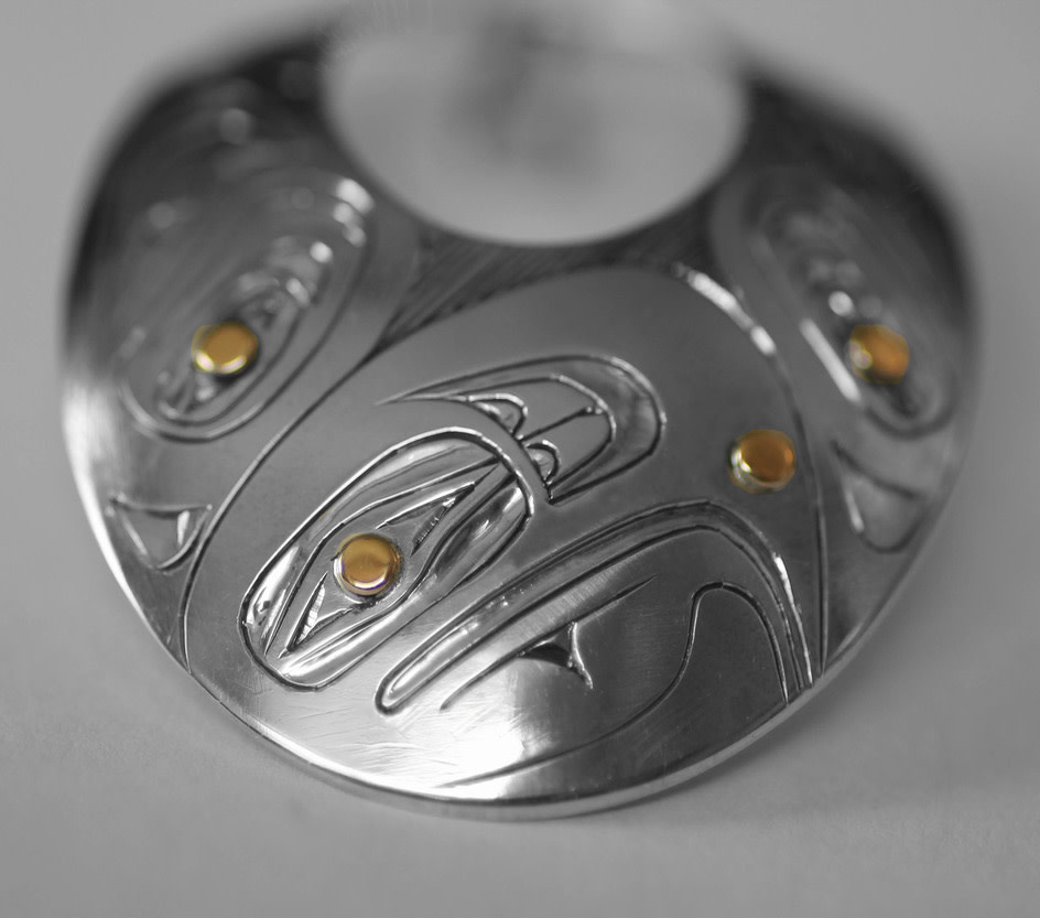 Oval Silver Haida Eagle Pendant with Gold Eyes