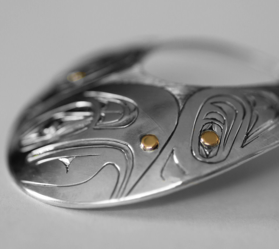 Oval Silver Haida Eagle Pendant with Gold Accents