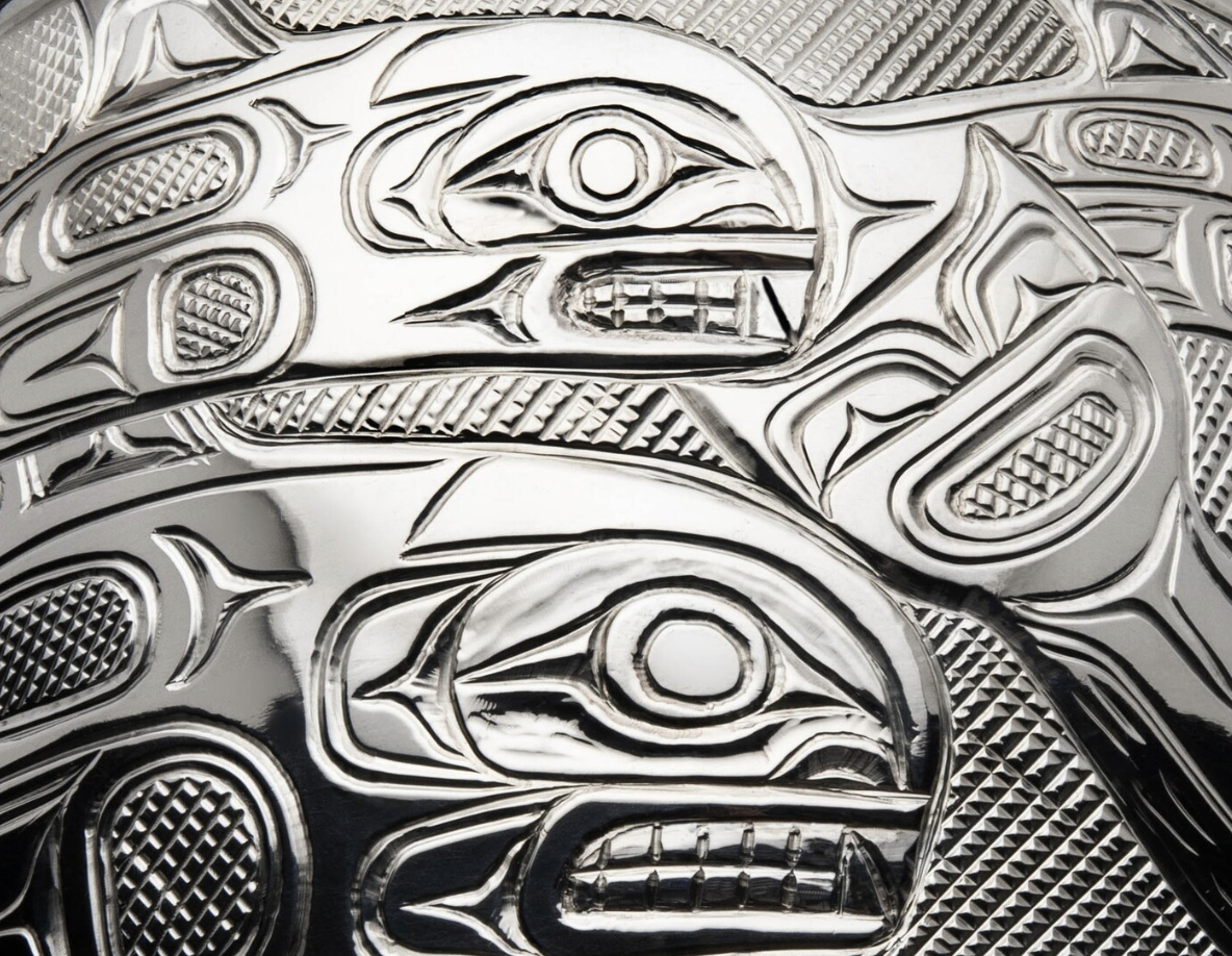 close up of engraving on silver bracelet