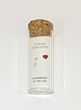 Stud earrings in a bottle