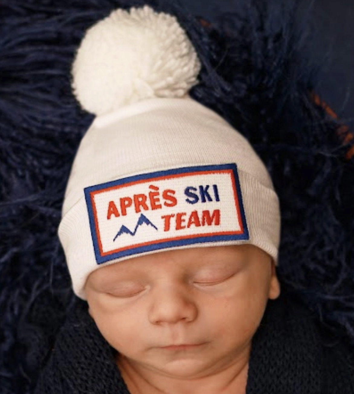 Ily Bean Apres Ski Team Baby Hat with White Pom Pom