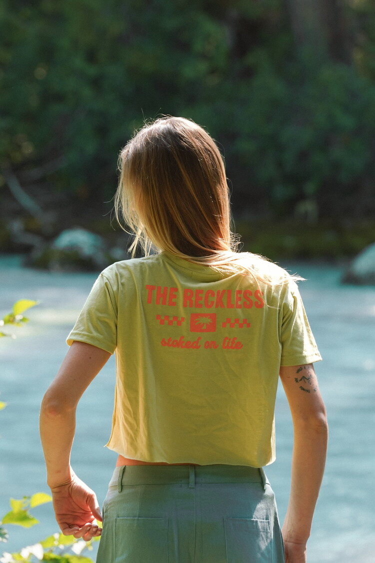Notice the reckless WOMEN'S STOKED ON LIFE CROP TEE CHARTREUSE