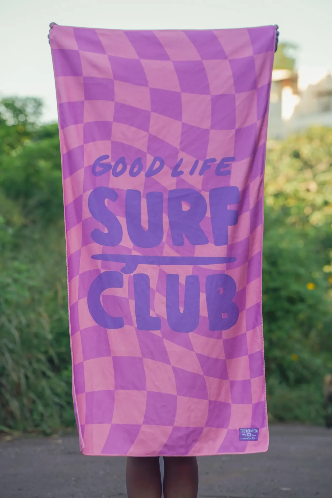 Notice the reckless CHECKERED TOWEL