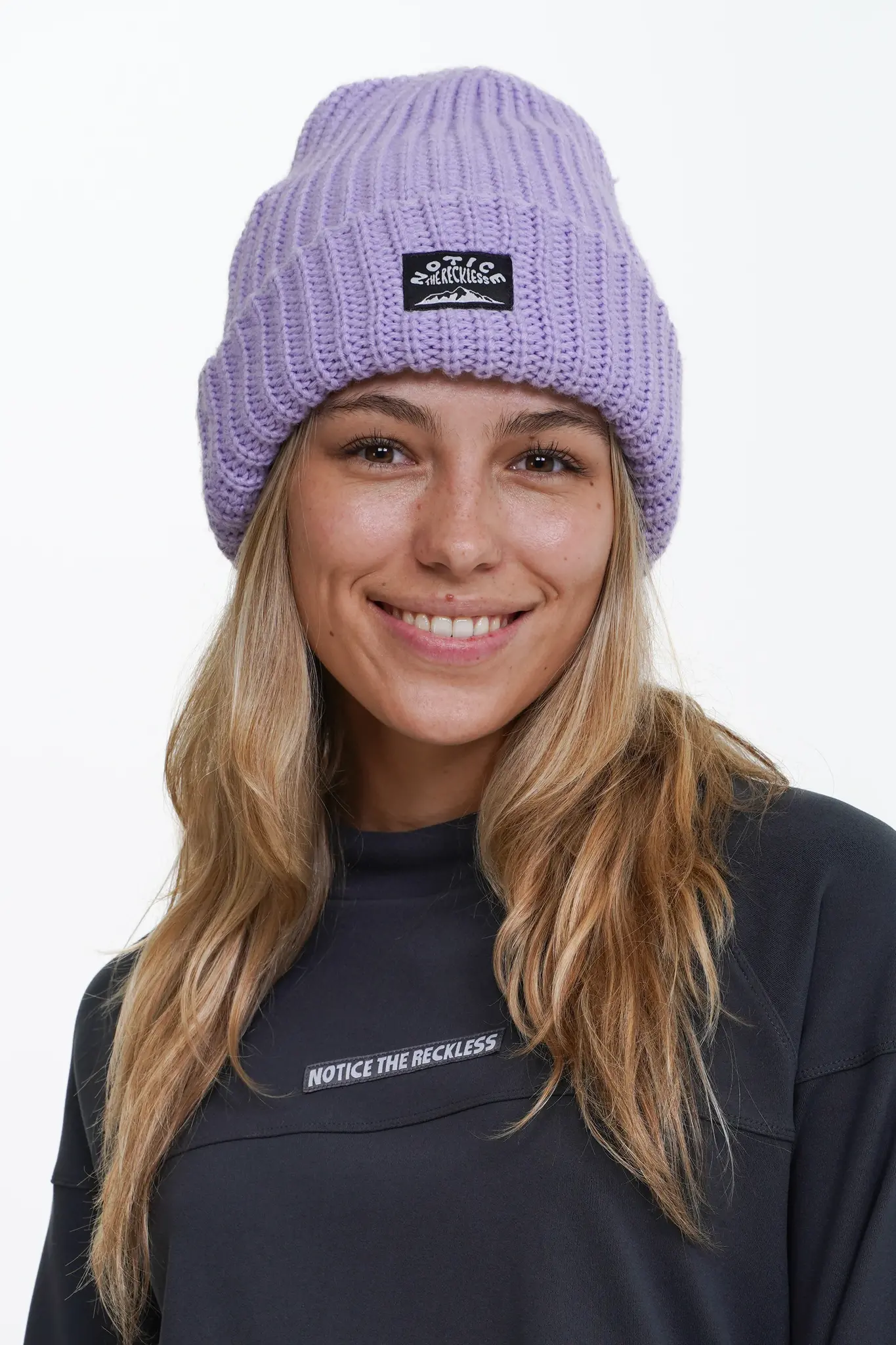 Notice the reckless WOMEN'S BIG LILAC BEANIE