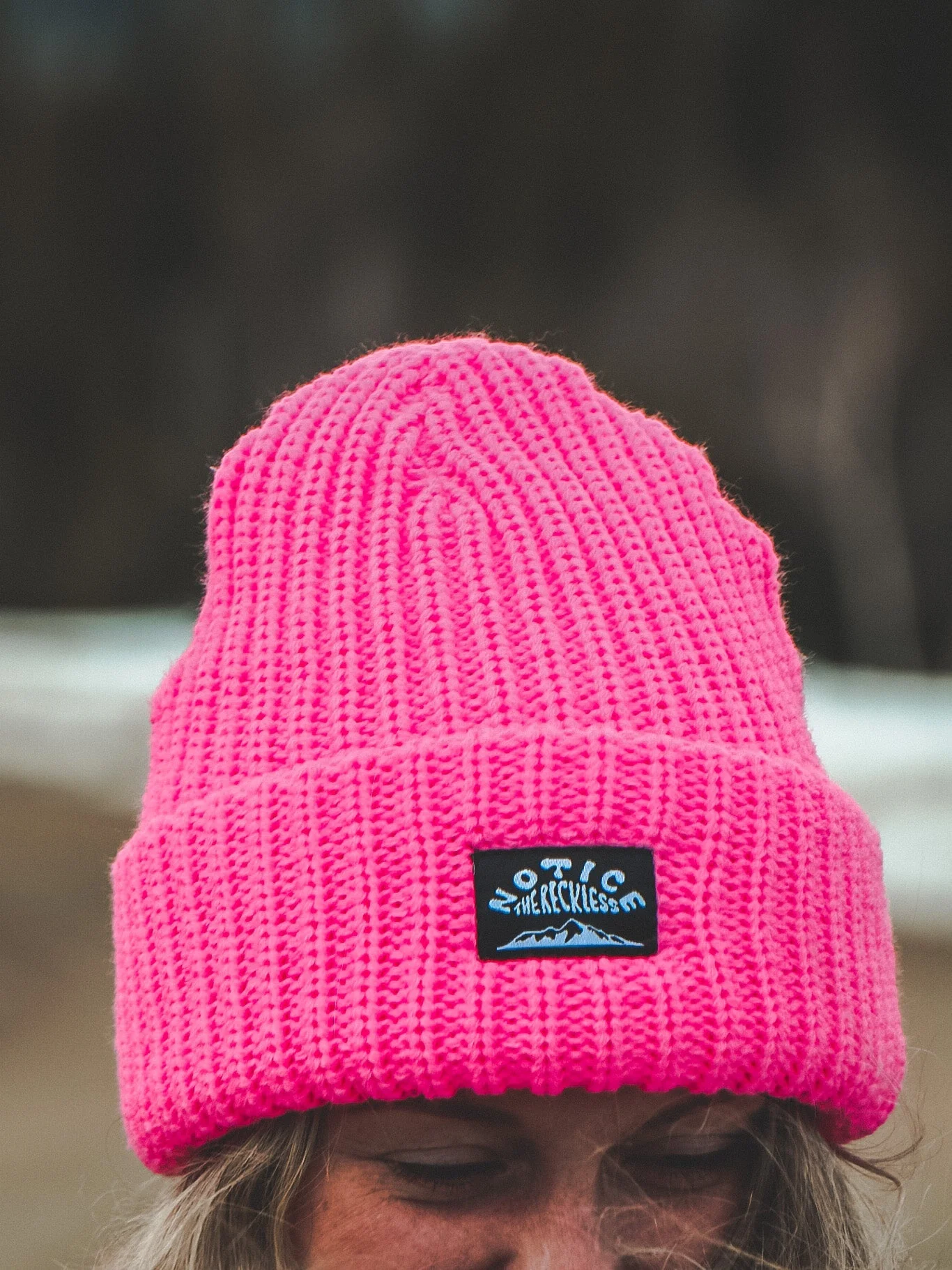 Notice the reckless FEMMES BIG NEON PINK BEANIE