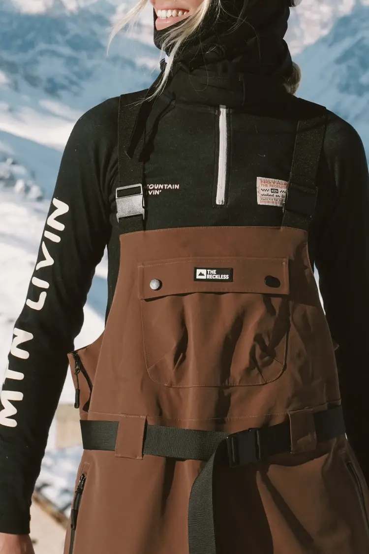 Notice the reckless WOMEN'S MUDSTONE 3-LAYER OUTER SHELL BIB