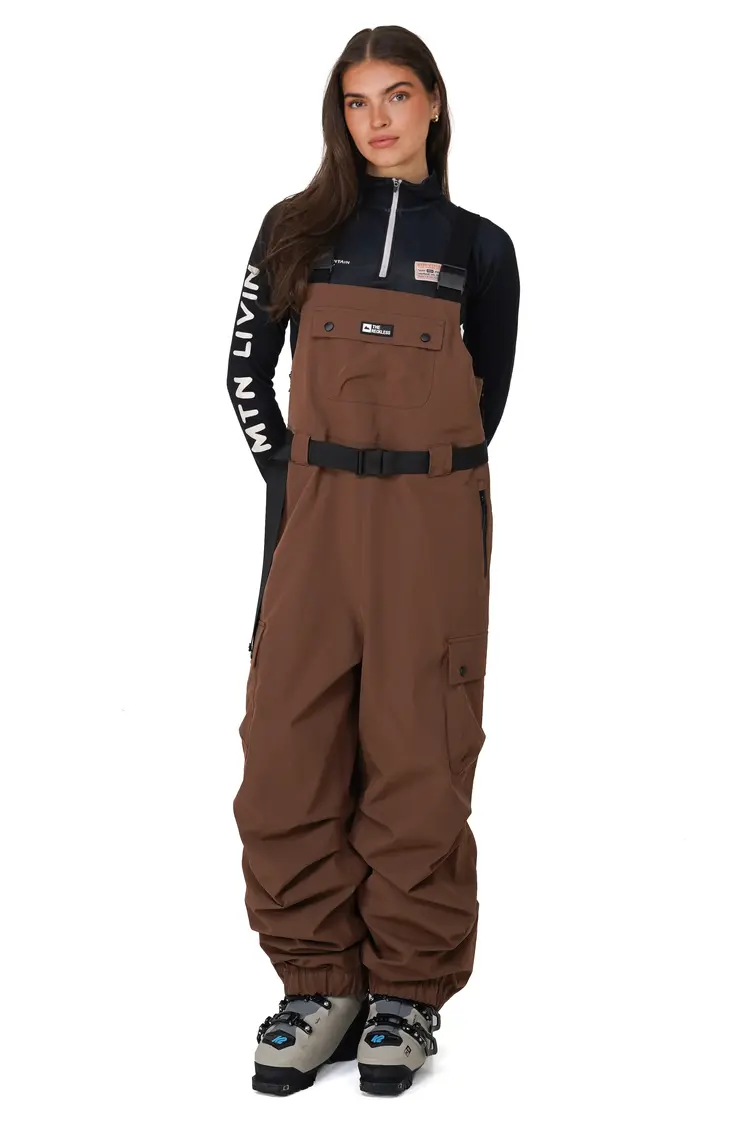 Notice the reckless WOMEN'S MUDSTONE 3-LAYER OUTER SHELL BIB