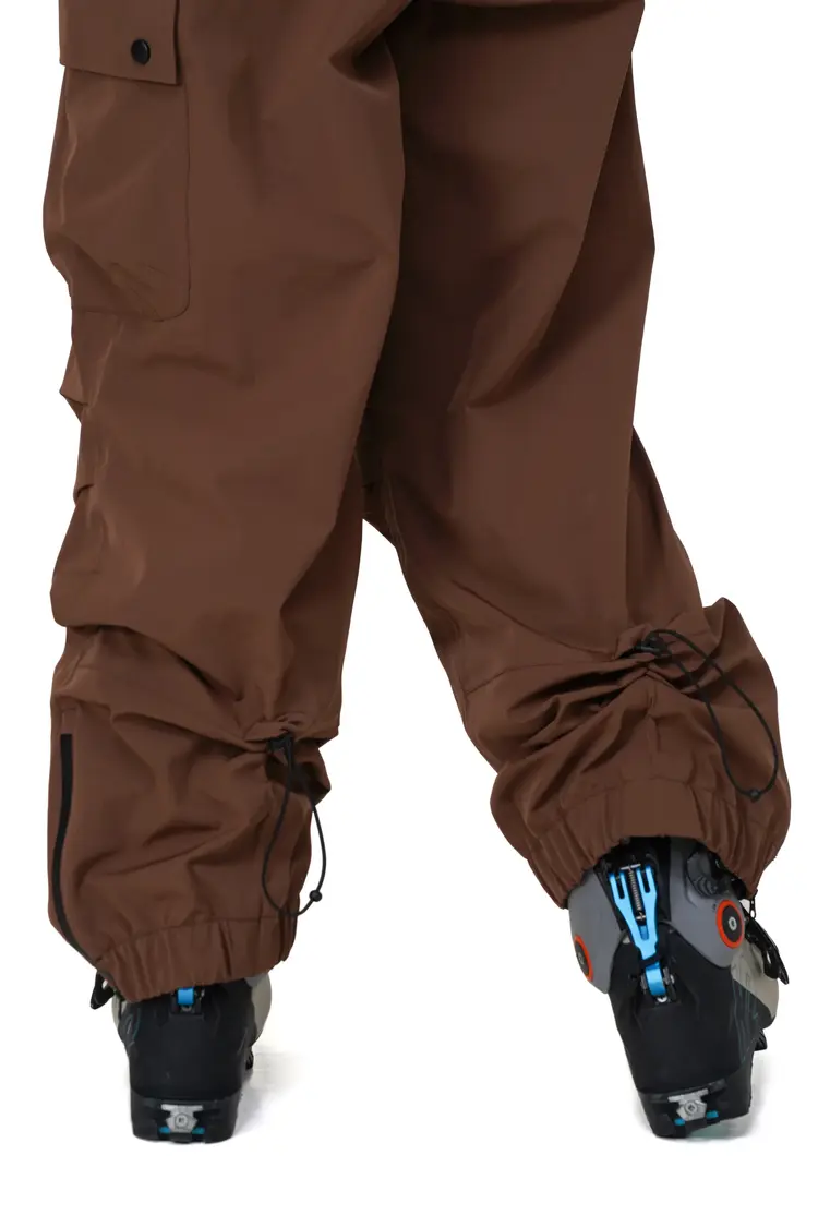 Notice the reckless WOMEN'S MUDSTONE 3-LAYER OUTER SHELL BIB