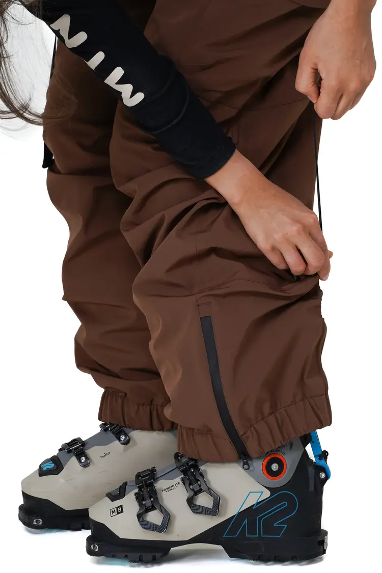 Notice the reckless WOMEN'S MUDSTONE 3-LAYER OUTER SHELL BIB