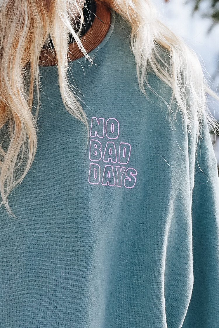 Notice the reckless WOMEN'S NO BAD DAYS CROPPED LONG SLEEVE