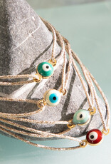 Sophie Deschamps Brass Eye Bracelet on Gold Cord