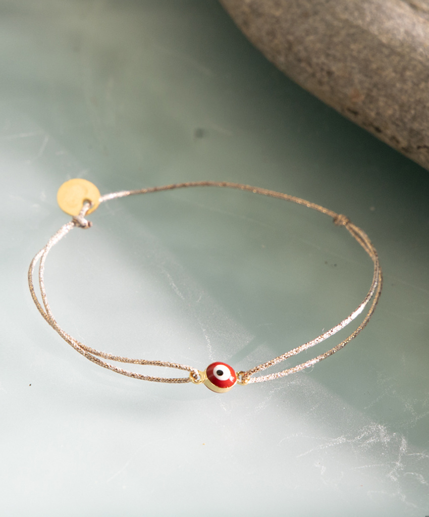 Sophie Deschamps Brass Eye Bracelet on Gold Cord