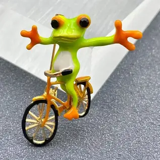 WHIMSICAL FROG ON A BIKE PIN