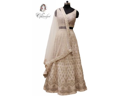 L.Peach Lehenga Choli with embroidery and pearl detailing L.Peach Lehenga Choli with embroidery and pearl detailing