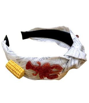 https://cdn.shoplightspeed.com/shops/603785/files/54047584/310x358x1/knotted-headband-with-crawfish-and-corn.jpg