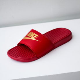 red gold nike flip flops