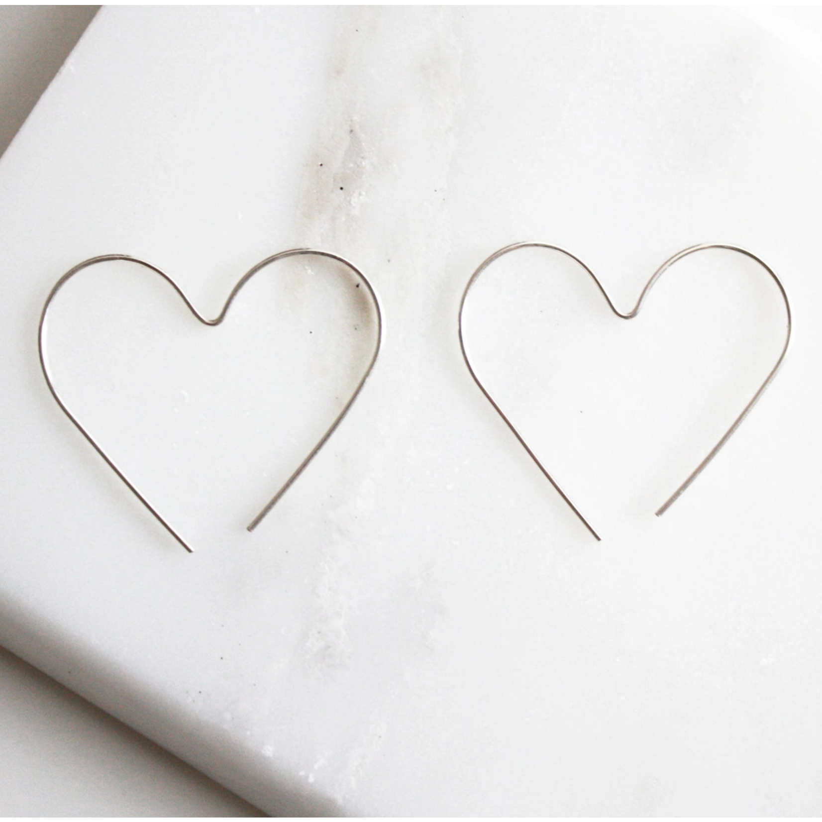 Hooks & Luxe Heart Hoop Earrings- Silver