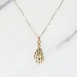 The Gilded Witch Skeleton Hand Necklace