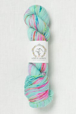 Image of La Bien Aimee Merino Super Sock Wee Rainbow on a Vespa