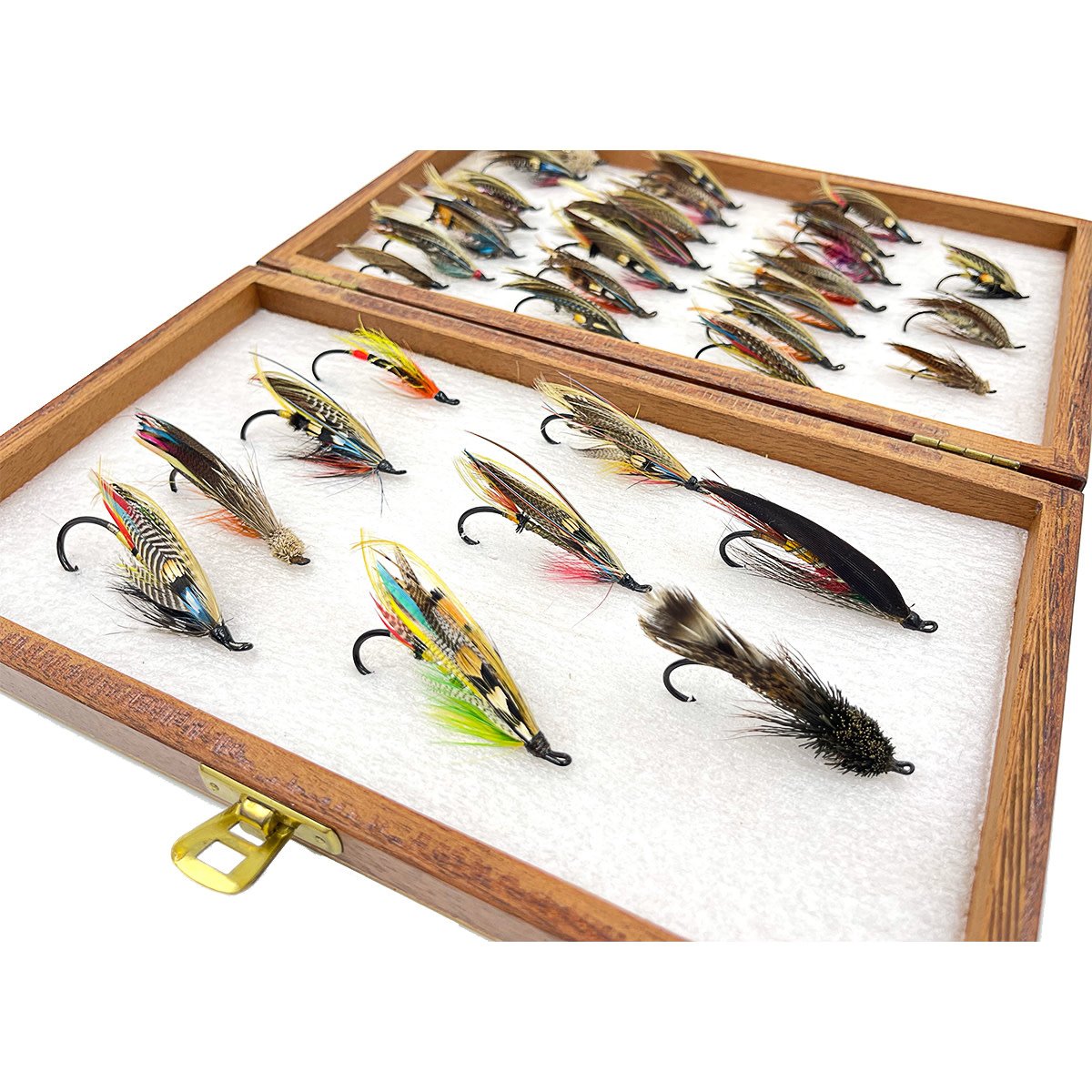 Old Wooden Fishing Fly Box with Salmon Flies on a Wooden Table Top