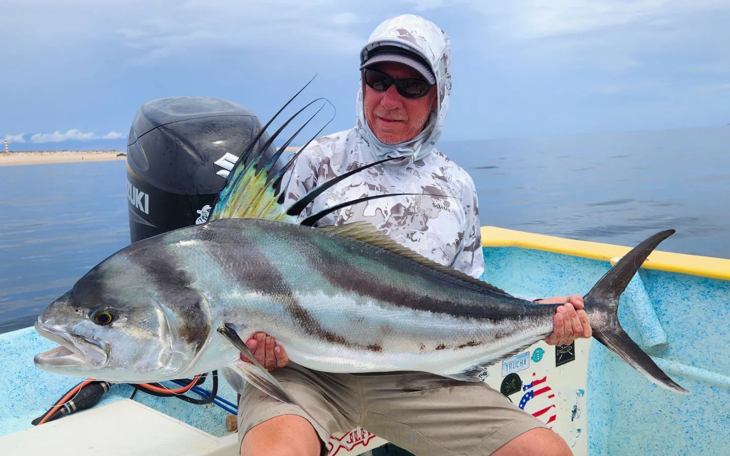 Baja House, MX Fishing - angler standing on boat with fly rod
