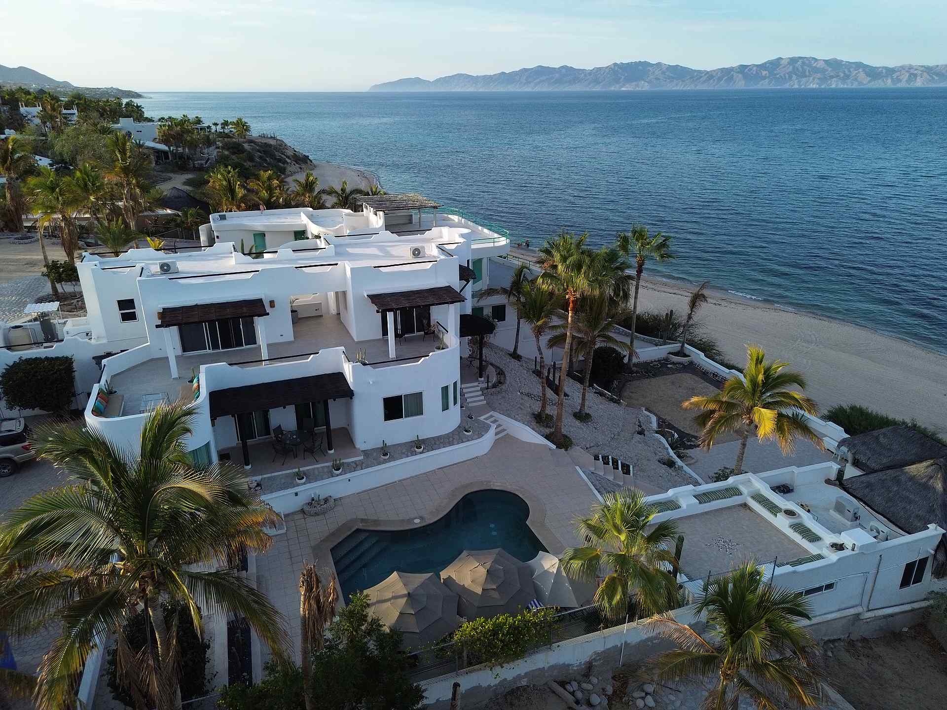 Baja House, MX Fishing - angler standing on beach with fly rod