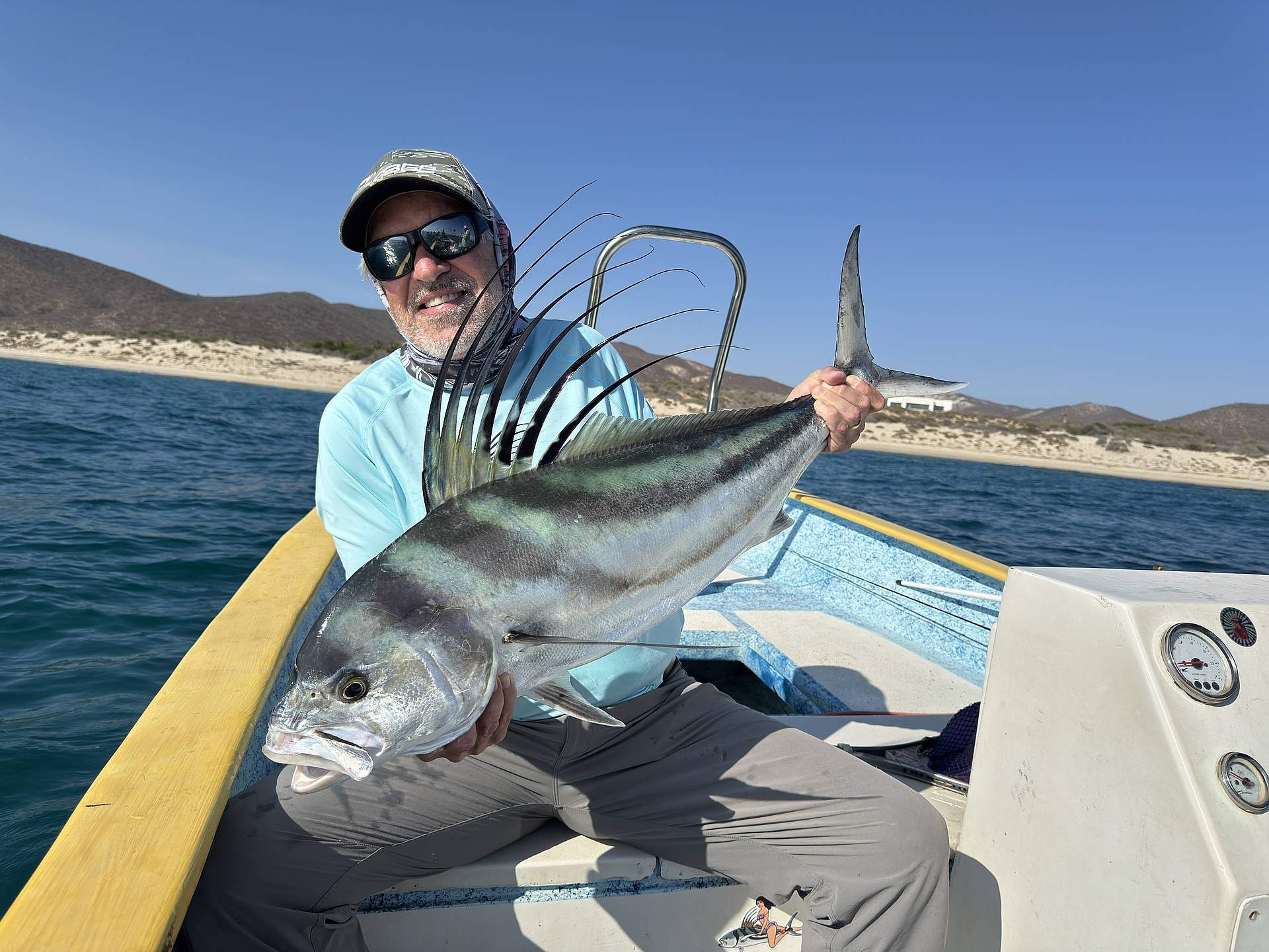 Baja House, MX Fishing - angler standing on beach with fly rod