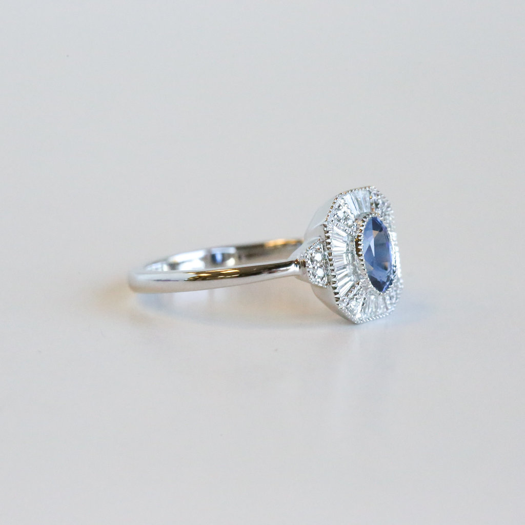 American Jewelry 14K White Gold 0.65ctw Sapphire & 0.25ctw Diamond Baguette Halo Ring (Size 7)