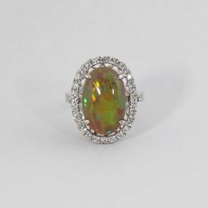 American Jewelry 14K White Gold Ladies Halo Ring with 9.1ct Oval Opal Center & .64ctw Round Brilliant Diamonds