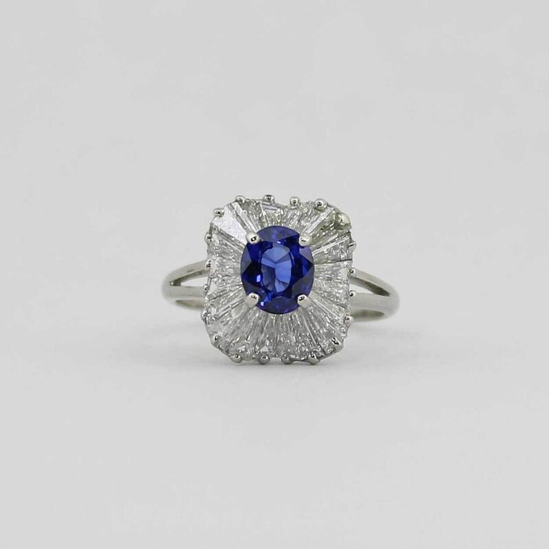American Jewelry Platinum Oval Blue Sapphire & Baguette Diamond Ballerina Halo Ladies Ring (Size 6.5)