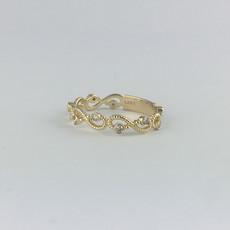 American Jewelry 14k Yellow Gold .14ctw Diamond Wave Stackable Wedding Band (Size 6.5)