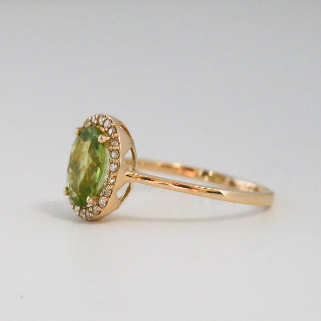 American Jewelry 14k Yellow Gold .20ctw Diamond and 1.93ctw Peridot Halo Ring (size 7)