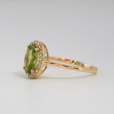 American Jewelry 14k Yellow Gold .20ctw Diamond and 1.93ctw Peridot Halo Ring (size 7)