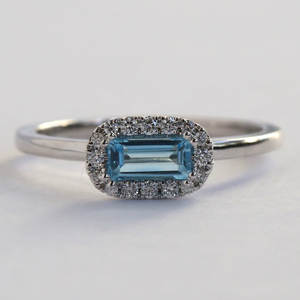 American Jewelry 10kw .12ctw Diamond Baguette Blue Topaz Halo Ring (Size 7)