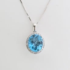 American Jewelry 14k White Gold Oval Blue Topaz .39ctw Round Diamond Halo Necklace