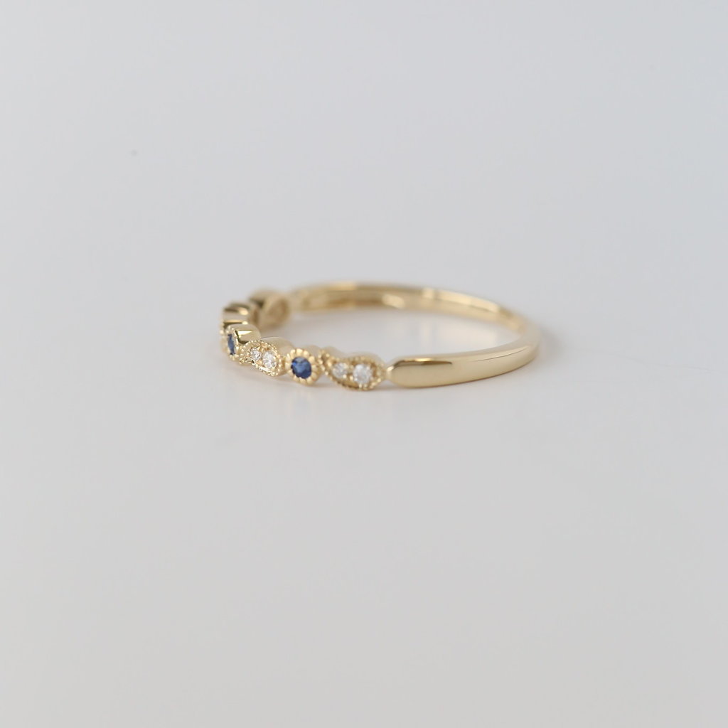 14k Yellow Gold .05ctw Diamond and .05ctw Blue Sapphire Paisley and Milgrain Band