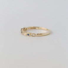 14k Yellow Gold .05ctw Diamond and .05ctw Blue Sapphire Paisley and Milgrain Band