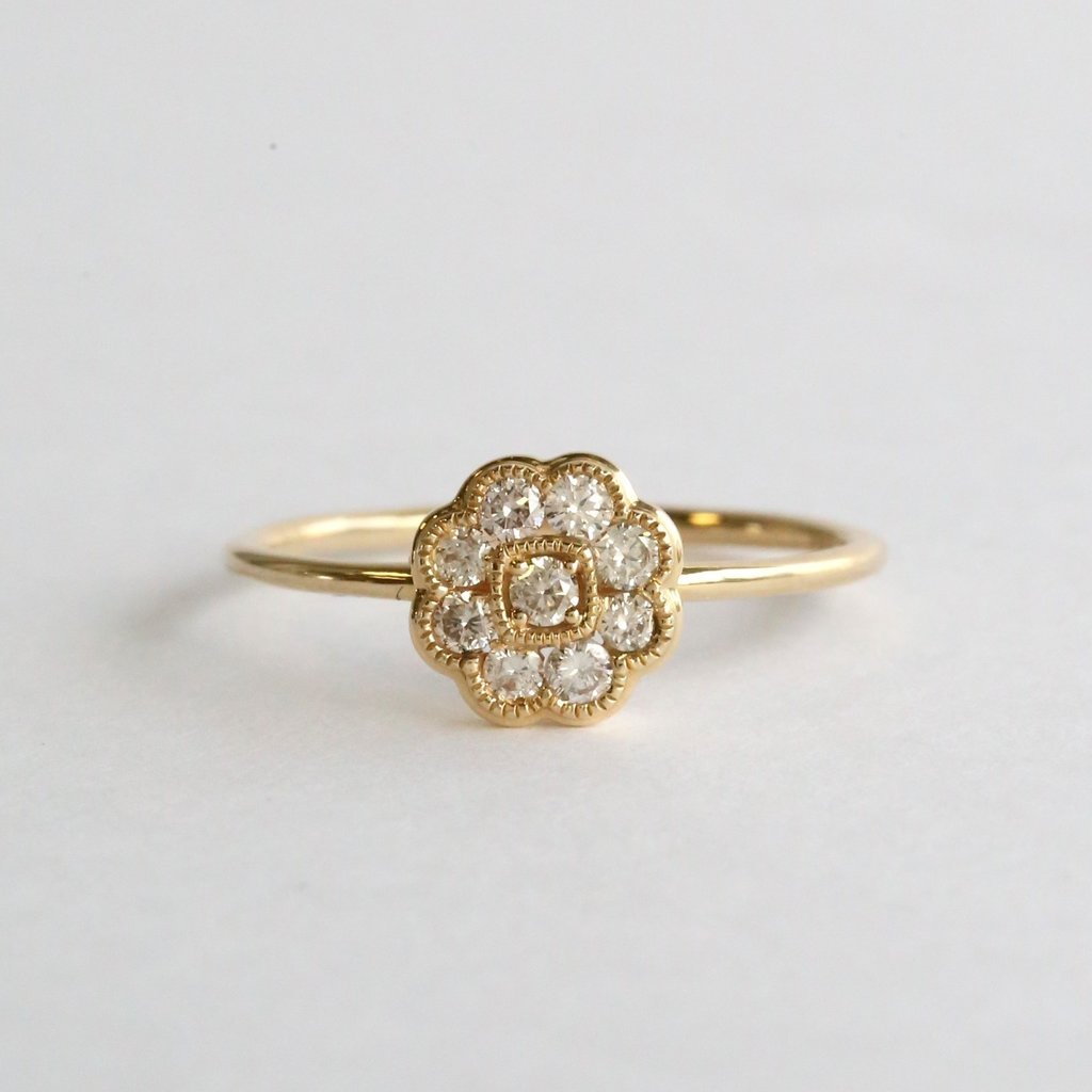 American Jewelry 14k Yellow Gold .25ctw Round Diamond Flower Petite Fashion Ring (Size 7)