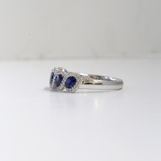 18k White Gold .22ct Diamond and 1.03ct Sapphire Infinity Inspired Halo Ring (6.5)