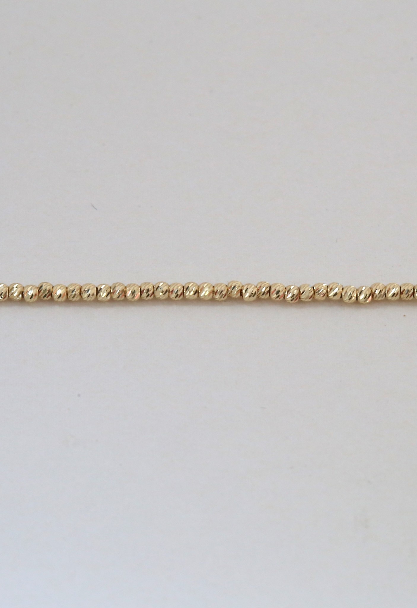 Diamond cut gold bead necklace discount