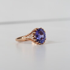 American Jewelry 14k Rose Gold .32ctw Diamond 2.29ct Oval Tanzanite Claw Prong Accented Ring (Size 6.5)