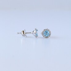 American Jewelry 14k White Gold .60ct Blue Topaz .08ctw Diamond Halo Stud Earriings