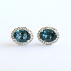 American Jewelry 14k White Gold .71ct London Blue Topaz .16ctw Diamond Oval Halo Stud Earrings