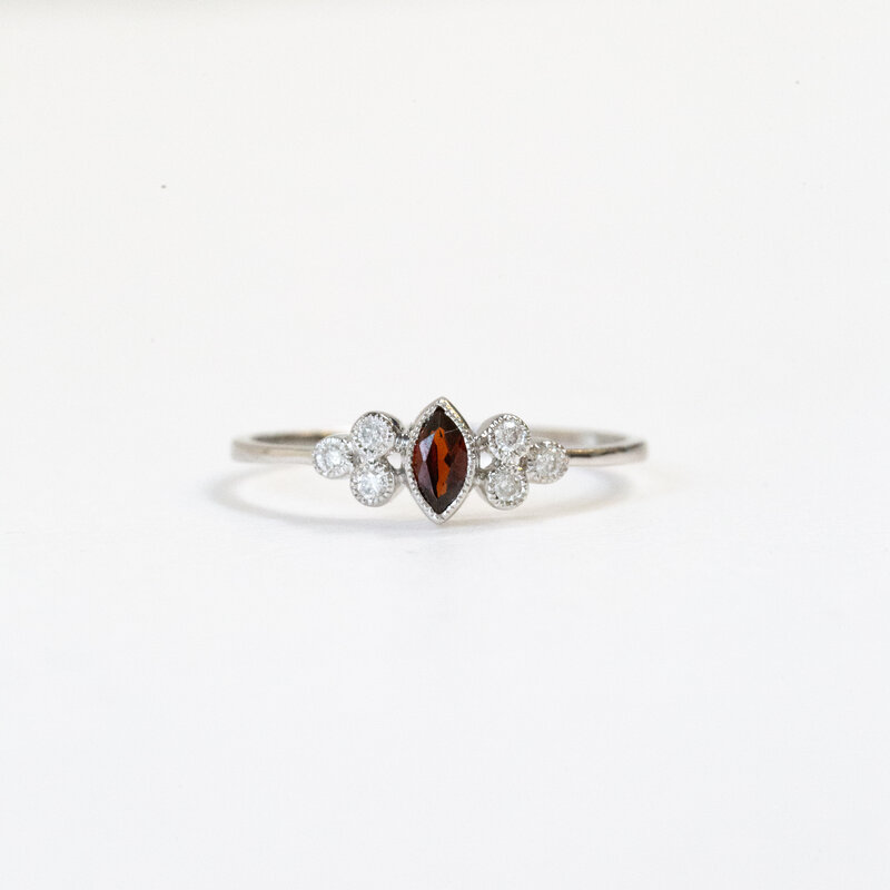 American Jewelry 14k White Gold 0.10ctw Diamond 0.17ct Garnet Marquise Bezel Set Ring (Size 7)