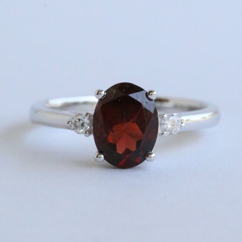 American Jewelry 14k White Gold Garnet .08ct Diamond Accent Three Stone Ring