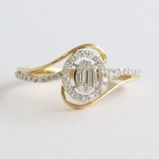 American Jewelry 14k Yellow Gold .25ctw Diamond Round & Baguette Bypass Ring (Size 7)