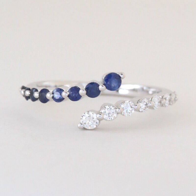 American Jewelry 14k White Gold .29ctw Sapphire .27ctw Diamond Bypass Ring