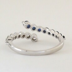 American Jewelry 14k White Gold .29ctw Sapphire .27ctw Diamond Bypass Ring