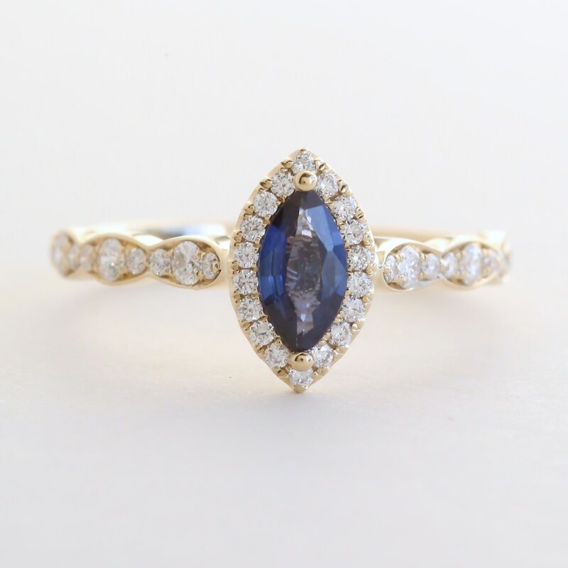 American Jewelry 14k Yellow Gold .31ctw Diamond .43ct Sapphire Scalloped Marquise Halo Ring